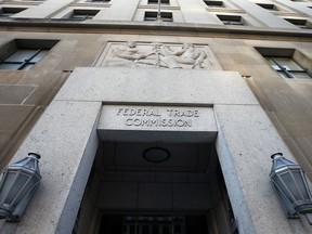 FILE- This Jan. 28, 2015, file photo shows the Federal Trade Commission building in Washington. The Federal Trade Commission says it plans to hold broad-based hearings about technology, competition and privacy of a kind it hasn't held in more than 20 years. The hearings were announced by Joseph Simons, a Republican who became chair of the FTC in May after being appointed by President Trump.