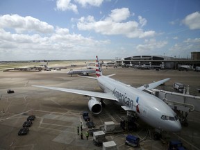 In this June 16, 2018 photo, American Airlines aircrafts are seen at Dallas-Fort Worth International Airport in Grapevine, Texas. American Airlines says it asked the Trump administration not to put migrant children who have been separated from their parents on its flights. In a statement Wednesday, June 20, American said it doesn't know whether any migrant children have been on its flights and doesn't want to profit from the current immigration policy of separating families.