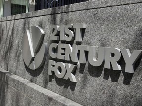 FILE - This Aug. 1, 2017, file photo shows the 21st Century Fox sign outside of the News Corporation headquarters building in New York. Disney has made a $52.4 billion all-stock offer for the bulk of Twenty-First Century Fox, including the studios behind the "Avatar" movies, "The Simpsons" and "Modern Family," along with National Geographic. Marvel would get back the characters previously licensed to Fox, reuniting X-Men with the Avengers.