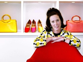 FILE - In this May 13, 2004 file photo, designer Kate Spade poses with handbags and shoes from her next collection in New York. Law enforcement officials say Tuesday, June 5, 2018, that New York fashion designer Kate Spade has been found dead in her apartment in an apparent suicide.