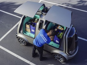 This undated photo provided by The Kroger Co. shows a driverless car that the Cincinnati-based company is about to test whether it can steer supermarket customers away from crowded grocery aisles with a fleet of diminutive driverless cars designed to lower delivery costs. The test program announced Thursday, June 28, 2018, could make Kroger the first U.S. grocer to make deliveries with robotic cars that won't have a human riding along to take control in case something goes wrong.