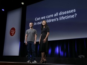 FILE- In this Sept. 20, 2016, file photo, Facebook CEO Mark Zuckerberg and his wife, Priscilla Chan, prepare for a speech in San Francisco. The Giving USA report, released Tuesday, June 12, 2018, said giving from individuals, estates, foundations and corporations reached an estimated $410 billion in 2017. The biggest increase was in giving to foundations, up 15.5 percent. This surge was driven by large gifts by major philanthropists to their own foundations, including $2 billion from Zuckerberg and Chan.