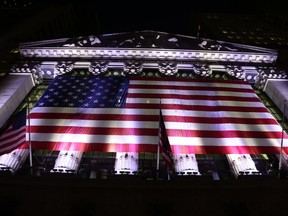 FILE- In this Feb. 17, 2017, file photo, an American flag hangs on the front of the New York Stock Exchange in New York. The U.S. stock market opens at 9:30 a.m. EDT on Thursday, June 7.