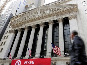 FILE- In this April 5, 2018, file photo, a pedestrian passes the New York Stock Exchange. The U.S. stock market opens at 9:30 a.m. EDT on Friday, June 29.