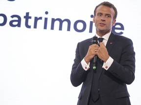 French President Emmanuel Macron delivers a speech during a conference to present a plan for the preservation of heritages sites at the Elysee palace, in Paris, France, Thursday, May 31, 2018. Macron is launching a national lottery to help restore France's magnificent chateaux and other historic monuments.