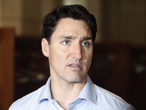 Prime Minister Justin Trudeau speaks to reporters before a caucus meeting on Parliament Hill in Ottawa on Wednesday, June 6, 2018.