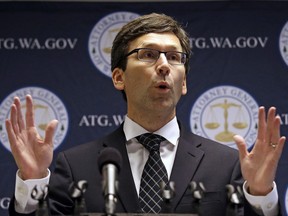 FILE - In this Nov. 28, 2017, file photo, Washington state Attorney General Bob Ferguson speaks at a news conference in Seattle. Ferguson is suing Google and Facebook, saying the companies failed to maintain information about political advertising as required by state law.