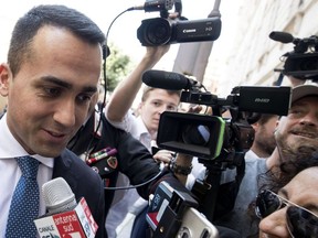 5-Star Movement leader Luigi Di Maio is surrounded by journalists as arrives at the Lower House, in Rome, Italy, 31 May 2018. Financial markets have calmed amid signs that Italy may avoid imminent elections after President Sergio Mattarella gave two populist parties time to figure out whether they can agree on an alternative to a euroskeptic economy minister.