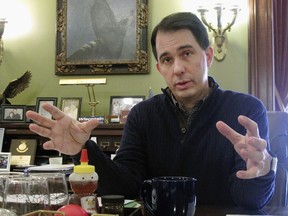 FILE - In this Jan. 8, 2018, file photo, Wisconsin Gov. Scott Walker speaks in Madison, Wis. A U.S. Supreme Court ruling making it easier to collect online sales taxes could yield billions of dollars for state and local governments _ if they decide to keep it. Rather than spend the windfall on schools, prisons or other government services, some Republican governors and lawmakers are proposing to give it away in the form of additional tax cuts to residents. Walker, running for a re-election this year, has suggested the extra revenue from online sales taxes could be used to expand tax breaks for senior citizens or families with children.