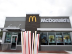 FILE - In this May 24, 2018, file photo, plastic straws from a McDonald's restaurant are shown in Doral, Fla. McDonald's said Friday, June 15, 2018 it will switch to paper straws at all its locations in the United Kingdom and Ireland, and test an alternative to plastic ones in some of its U.S. restaurants later this year.