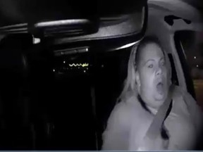 This image made from video Sunday, March 18, 2018, of a mounted camera provided by the Tempe Police Department shows an interior view moments before an Uber SUV hit a woman in Tempe, Ariz. The video shows a human backup driver in the SUV looking down until seconds before the crash. The driver looked up and appeared startled during the last moment of the clip.