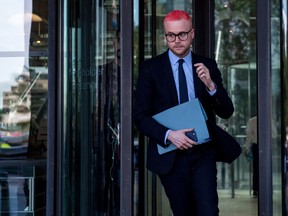Christopher Wylie, a whistleblower and former employee with Cambridge Analytica, leaves after attending a parliamentary select committee meeting with Alexander Nix, the former chief executive officer of Cambridge Analytica.