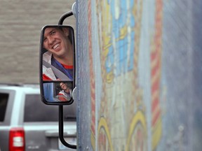 In this May 24, 2018, photo Amazon worker Tony Biallas looks through a mirror as he backs up an Amazon Treasure Truck into a parking spot in Seattle. The Treasure Truck is a quirky way for the online retailer to connect with shoppers in person, expand its physical presence and promote itself. Amazon has also used the trucks to try to bring people into Whole Foods, the grocery chain it bought last year. The trucks debuted two years ago and now roam nearly dozens of cities in the United States and England.