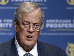 FILE - In this Aug. 30, 2013 file photo, Americans for Prosperity Foundation Chairman David Koch speaks in Orlando, Fla.  Koch is stepping down from the Koch brothers network of business and political activities. The 78-year-old cited health reasons in a letter distributed to company officials on Tuesday morning.