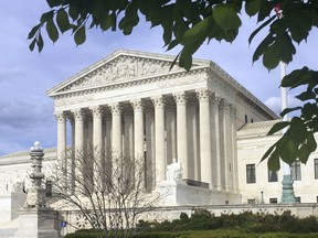 FILE - This April 23, 2018, file photo shows the Supreme Court in Washington.  The Supreme Court says states can force online shoppers to pay sales tax. The 5-4 ruling Thursday is a win for states, who said they were losing out on billions of dollars annually under two decades-old Supreme Court decisions that impacted online sales tax collection. The high court ruled Thursday to overturn those decisions.