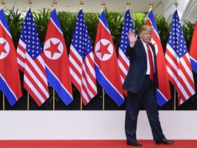 FILE - In this June 12, 2018, file photo, U.S. President Donald Trump waves after saying goodbye to North Korea leader Kim Jong Un at the Capella resort on Sentosa Island in Singapore. Trump says the Singapore summit put North Korea on a path to eliminating its nuclear weapons. If that proves true, then it also may have poked a hole in the Pentagon's main argument for a multibillion-dollar expansion of missile defense. Although uncertainty remains over North Korea's intentions, if it does disarm, then Congress may see less logic to spending $6 billion or more to expand a missile defense system based in Alaska.