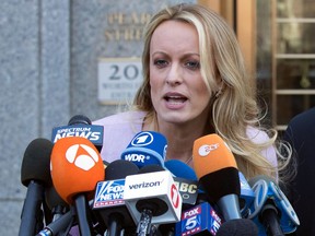 FILE - In this April 16, 2018, file photo, adult film actress Stormy Daniels speaks outside federal court in New York. Daniels says her ex-lawyer was a "puppet" for President Donald Trump and worked with the president's attorney to get her to appear on Fox News and falsely deny having sex with Trump. The allegations are made in a lawsuit filed June 6 in Los Angeles. The lawsuit alleges Trump's lawyer Michael Cohen "colluded" with Daniels' then-attorney Keith Davidson to have her deny the relationship on Fox News after a tabloid magazine story about Daniels and Trump.