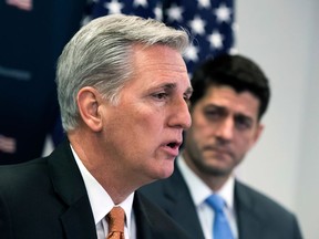 FILE - In this Feb. 6, 2018, file photo, House Majority Leader Kevin McCarthy, R-Calif., joined at right by House Speaker Paul Ryan, R-Wis., talks with reporters at the Capitol in Washington. The GOP-controlled House is moving ahead on a White House plan to cut almost $15 billion in leftover spending, scheduling a vote after President Donald Trump took to Twitter to sell the idea. A spokesman for  McCarthy said June 6 that the House will vote June 7 on the measure, which had appeared to languish after Trump submitted it last month.