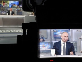 Russian President Vladimir Putin is seen on the tv camera screen as he answers a question during his annual call-in show in Moscow, Russia, Thursday, June 7, 2018. Putin hosts call-in shows every year, which typically provide a platform for ordinary Russians to appeal to the president on issues ranging from foreign policy to housing and utilities.