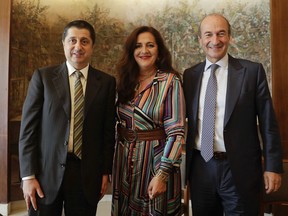 Angela Missoni, center, is flanked by Michele, Norsa, right, and Maurizio Tamagnini during a press conference in Milan, Italy, Friday, June 15, 2018. The family-owned Missoni fashion house has announced that the Italian investment fund FSI will take a 41.2 percent stake to help expand the business.