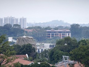 FILE - In this June 6, 2018, file photo, part of the facade of Capella Hotel is seen in the center of the photo, on Sentosa Island in Singapore. Ahead of a planned summit Tuesday, June 12,  in Singapore between President Donald Trump and North Korean autocrat Kim Jong Un, there has been talk of complete denuclearization, North Korea has shut down (for now) its nuclear test site, and senior U.S. and North Korean officials have shuttled between Pyongyang and Washington for meetings with Kim and Trump. The top U.S. diplomat declared that "Chairman Kim shares the objectives with the American people" amid talk of a grand bargain that could see North Korean disarmament met with a massive influx of outside aid.