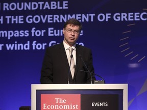 Valdis Dombrovskis, Vice-President of the European Commission addresses the audience during an economic conference at Lagonissi resort, south of Athens, Thursday, June 14, 2018. The European Commission's vice president says Greece's exit from its bailout in August would be "a delicate yet perfectly doable exercise, provided that all parties show commitment and act responsibly." (AP Photo)