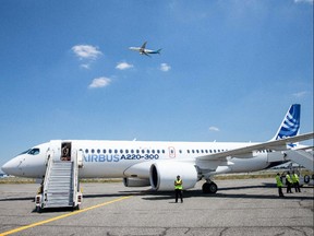 A new Airbus A220 single-aisle aircraft on the tarmac.