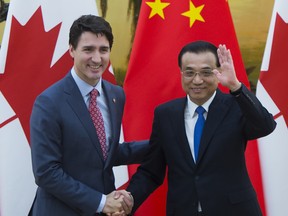 Prime Minister Justin Trudeau and Chinese Premier Li Keqiang conclude a press conference at the Great Hall of the People in Beijing, China.