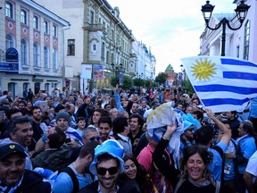 Uruguay fans cheer in central Nizhny Novgorod  on the eve of the Russia 2018 World Cup quarter final football match between France and Uruguay.