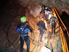 A group of Thai Navy divers in Tham Luang cave during rescue operations for the 12 boys and their football team coach trapped in the cave at Khun Nam Nang Non Forest Park in the Mae Sai district of Chiang Rai province.
