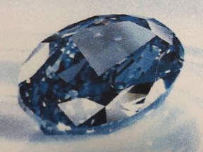 This undated photo made available Thursday July 26, 2018, by Dubai Police, shows a rare $20 million blue diamond confiscated by Police in Dubai, United Arab Emirates. Dubai police say they've recovered a rare $20 million blue diamond stolen from a city company's vault and smuggled to Sri Lanka inside a pair of sneakers in a shoebox.