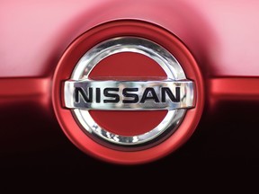 FILE - This June 14, 2018, file photo, shows a Nissan logo on a Nissan Concept 2020 Vision Gran Truismo on display at the automaker's showroom in Tokyo. Nissan Motor Co. says it has altered results of exhaust emissions and fuel economy tests of its new vehicles sold in Japan, in the latest misconduct to surface at the Japanese automaker.