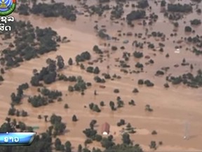 In the image made from aerial video taken Tuesday, July 24, 2018, villages are inundated with floodwaters from a collapsed dam in Attapeu province, southeastern Laos. The KPL news agency said Wednesday on its website that officials in Attapeu province also reported more than 1,300 houses damaged by flooding after an auxiliary dam at the Xepian-Xe Nam Noy hydropower project partially collapsed on Monday night. (LNT via AP)