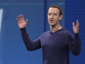 FILE - In this May 1, 2018, file photo, Facebook CEO Mark Zuckerberg makes the keynote address at F8, Facebook's developer conference in San Jose, Calif. Remarks from Zuckerberg have sparked criticism from groups such as the Anti-Defamation League. Zuckerberg, who is Jewish, told Recode's Kara Swisher in an interview that although he finds Holocaust denial "deeply offensive," such content should not be banned from Facebook.