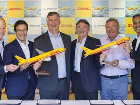 From left to right: Kevin McAllister CEO Boeing Commercial Airplanes; Ihssane Mounir, VP Sales & Marketing The Boeing Company; Dan Abraham, VP Sales Europe Boeing Commercial Airplanes; Ken Allen, CEO DHL Express; Charlie Dobbie, COO DHL Express; Mike Parra, CEO DHL Express Americas.