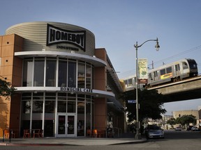 A Metro Line train passes by Homegirl Cafe Monday, July 16, 2018, in Los Angeles. The LA breakfast and lunch spot with a Latino twist, offers a unique dining experience with food prepared by former gang members gaining new skills. The popular cafe in the city's Chinatown allows visitors to relish carefully crafted meals while getting inspired by former inmates who willingly tell stories on how they are seeking a better life.