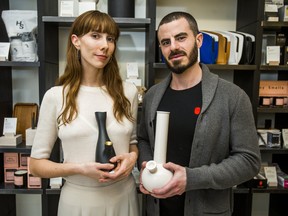 Tokyo Smoke's Ljubica Kostovic and Josh Lyon hold bongs at the Toronto coffee shop.