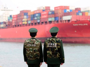 Some Chinese ports had delayed clearing goods from the United States, four sources said on Friday.