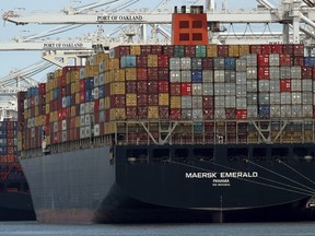 The container ship Maersk Emerald is unloaded at the Port of Oakland, Calif.