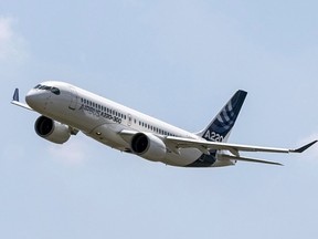 An Airbus A220 lands at Toulouse-Blagnac airport, southwestern France on July 10, 2018. Airbus says JetBlue has signed a deal to buy 60 A220-300 aircraft.