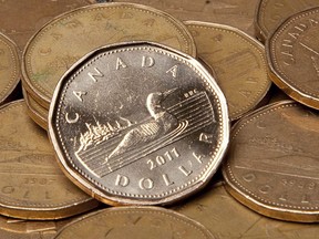 The Canadian dollar was trading at 75.93 cents US, down from Friday's average value of 75.94 cents US. Canadian dollars are pictured in Vancouver, Sept. 22, 2011.
