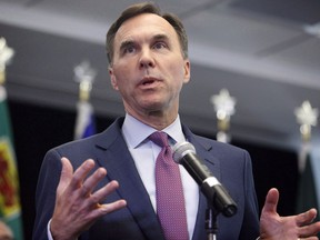 Finance Minister Bill Morneau speaks to reporters after a meeting with provincial and territorial finance ministers in Ottawa on Tuesday, June 26, 2018. The federal government ran a surplus of $600 million in the second month of its fiscal year helped along by a boost in tax revenues.