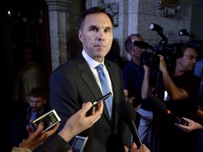 Minister of Finance Bill Morneau speaks to reporters as he arrives for Question Period in the House of Commons on Parliament Hill in Ottawa on June 18, 2018. The federal Finance Department faces a moderate risk of a cyberattack that could deliver a significant blow to its ability to carry out some crucial government operations, says a newly released internal analysis. Finance, like other federal departments, publicly discloses a handful of its corporate risks -- but a list obtained by