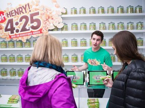 Customers are served at a pop-up shop selling the Oh Henry! 4:25 chocolate bar in a handout photo. Undeterred by a ban on marijuana-infused edibles as part of the initial rollout of legal recreational pot in Canada, food companies have found a way to cash in on the buzz by catering to post-consumption cravings with marijuana-free munchies. The country is gearing up for the legalization of cannabis for recreational use on October 17, but edible products infused with pot will remain illegal until specific government regulations are rolled out in 2019 at the earliest.
