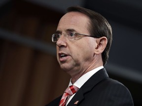 Deputy Attorney General Rod Rosenstein speaks during a news conference at the Department of Justice, Friday, July 13, 2018, in Washington.