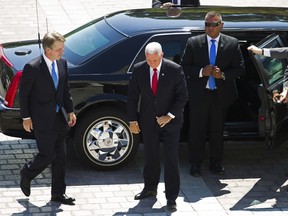 Vice President Mike Pence, center, accompanied by Supreme Court nominee Judge Brett Kavanaugh, arrives at the U.S. Capitol in Washington on Tuesday, July 10, 2018.