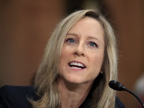 Kathleen Kraninger, President Donald Trump's nominee to be the director of the Bureau of Consumer Financial Protection, testifies before a Senate Banking Committee hearing on her confirmation on Capitol Hill in Washington, Thursday, July 19, 2018.