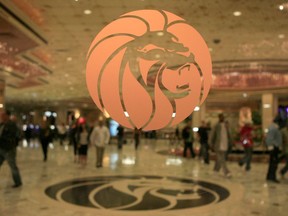 ** HOLD FOR STORY ** FILE ** The MGM logo is seen at the main entrance of MGM Grand hotel-casino in Las Vegas in this Feb. 22, 2006 file photo. The operator of the Mandalay Bay casino-resort from which a gunman carried out the largest mass shooting in U.S. history has filed federal lawsuits against hundreds of victims.  MGM Resorts International argues in lawsuits filed Friday, July 13, 2018 in Nevada and California that it is has "no liability of any kind" to the defendants under a federal law enacted in the wake of 9/11 terrorist attacks.