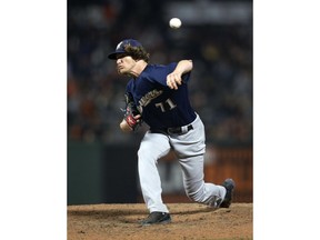 Milwaukee Brewers pitcher Josh Hader (71) delivers against the San Francisco Giants during the sixth inning of a baseball game, Thursday, July 26, 2018, in San Francisco.