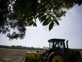 In this June 21, 2018, photo, Parrish Akins plants cotton seeds on his farm in Nashville, Ga. Akins estimates that 50 percent of his cotton is exported out of the country, China being one of the main recipients. "We're very concerned about tariffs," said Akins, who despite the potential effects on his business supports Trump's policy on tariffs. "We'll suffer in the short term but the long term effects of fair trade will be positive for American agriculture and American industry."